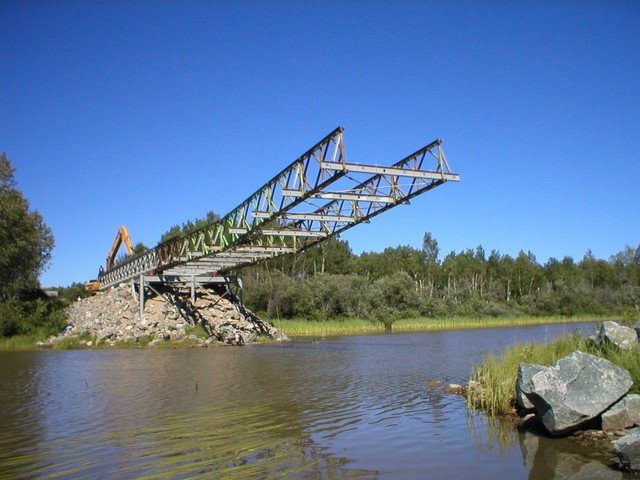 Completed "Bays" are launched across the gap. Note "landing nose" on front of bridge.