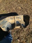 Inside of right fender.  The undercoat is peeling off of the strata