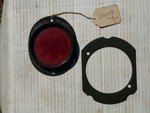 reflector and retainer for spare tire carrier 