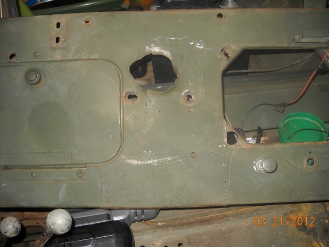 Here is Bubba's work on the dash.  He put the steering column through the light switch hole and then riveted the original steering column  area shut.  I hate Bubba...