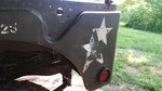 The jeep has at least 3 layers of military paint. Here you can see I have partially recovered three different stars on the rear quarter panel on the drivers side