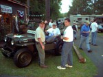 State senetor Stan Jordan in the jeep and his aid to the right. Stan Jordan was the chairman of the Veterans affairs committie