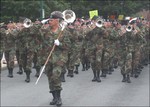 Drum major (since retiered) in front of superintendents Quaters